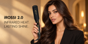 A woman with long wavy brown hair holds an iRossi 2.0 infrared heat styling tool.